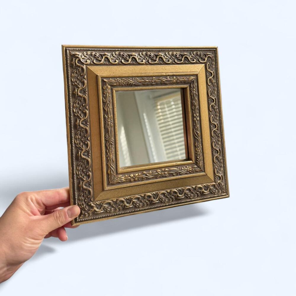 Small ornate gold mirror